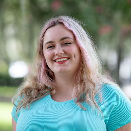 Taylor Campbell, one of our elopement photographers pictured in Forsyth Park.