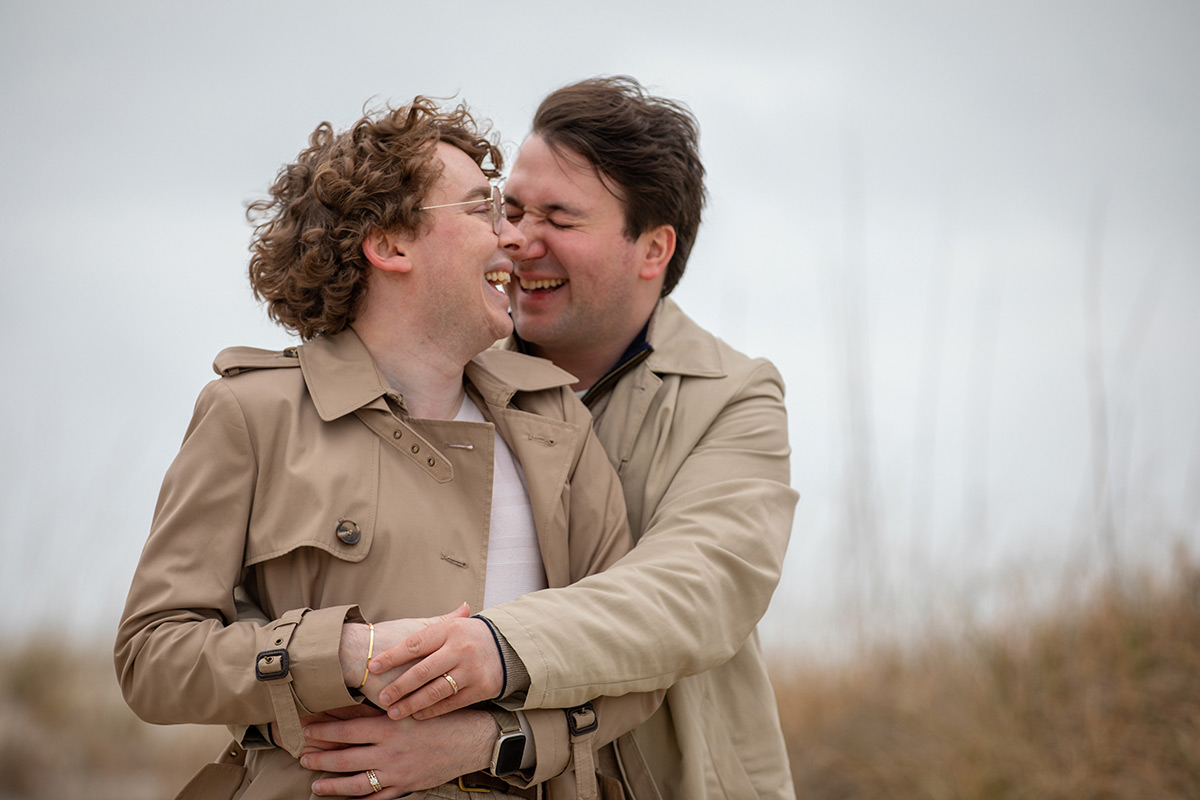 LGBT gay male couple on the beach on Tybee Island after their elopement