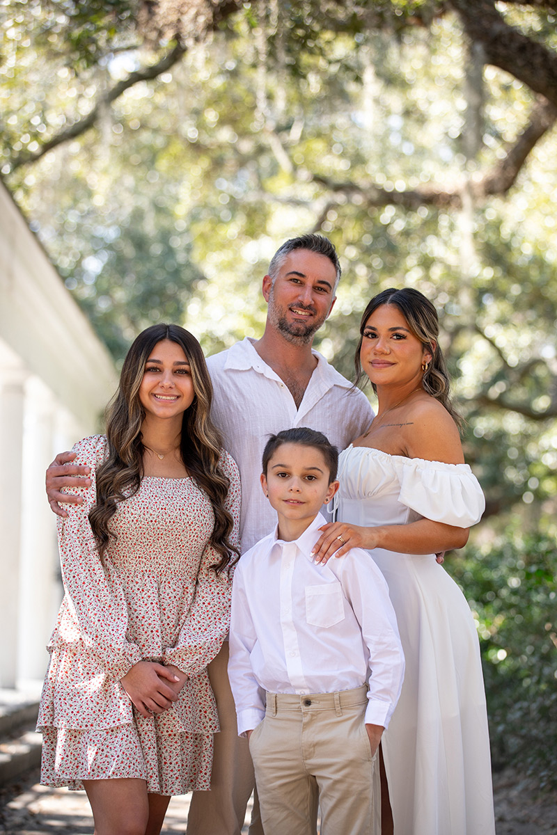 Beautiful family after a wedding in Forsyth Park in Savannah Georgia